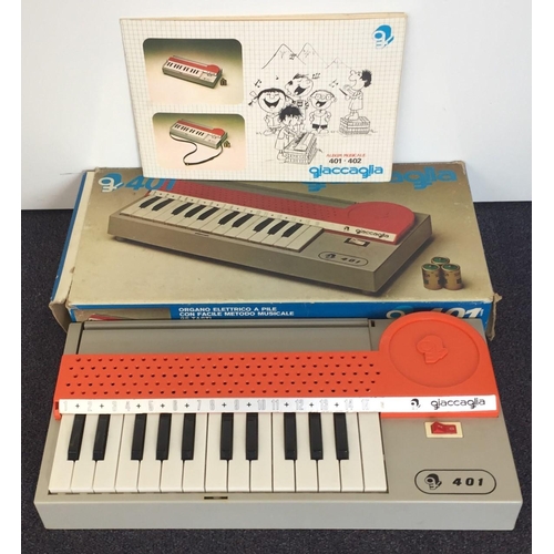 1736 - A vintage Giaccaglia portable, battery operated organ, no.401, with instructions & original box.