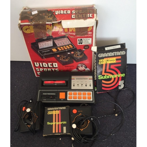 1807 - A Grandstand 10 colour programmable video sports centre(model SD070), original box, with cartrisges.