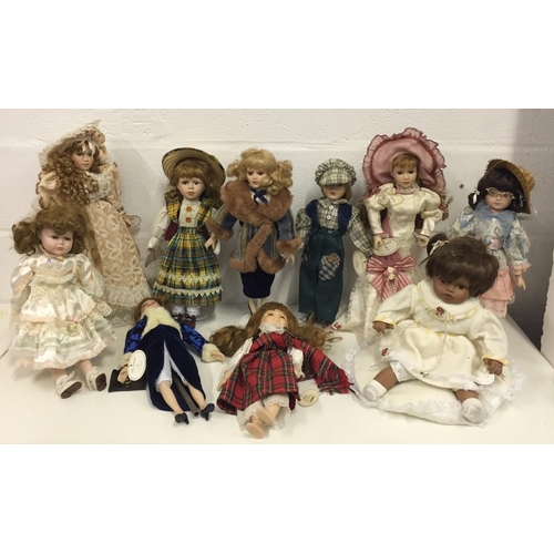 1834 - A collection of 10 unboxed porcelain dolls, including Lucy, Victoria, Scarlett, Ann, Pauline, Amber,... 