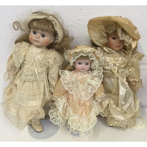 1841 - A collection of 19 unboxed porcelain dolls, including Knightsbridge. Some with stands.