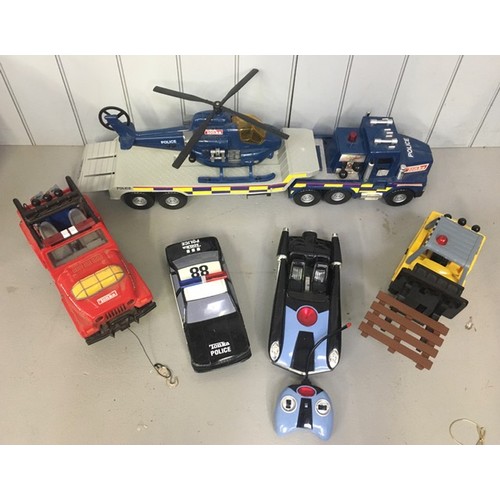 2383 - A mixed lot of four Tonka vehicles (Police lorry/trailer/helicopter; forklift; jeep; police car), to... 