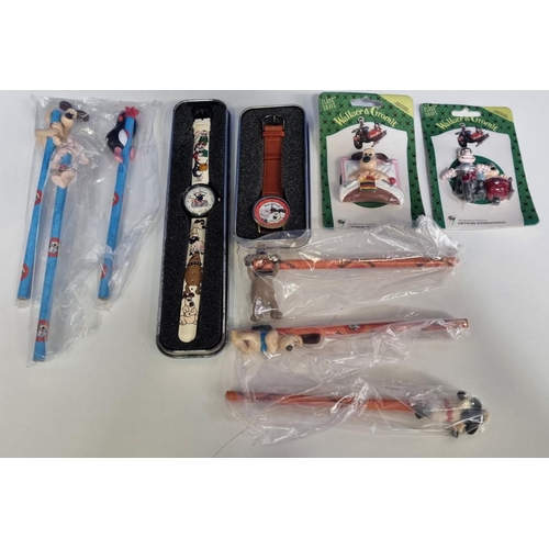 391 - An assortment of 'Wallace and Gromit' collectibles, to include two vintage 'Wesco' watches, pencils ... 