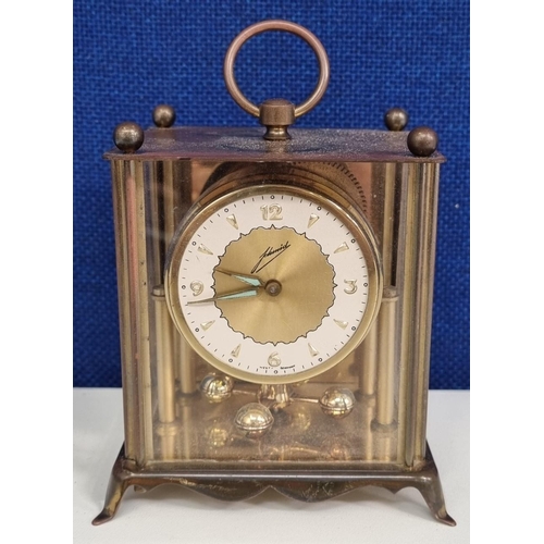 400 - A 'Johmid' mantel clock, made in West Germany. Untested. Height 9.5cm.