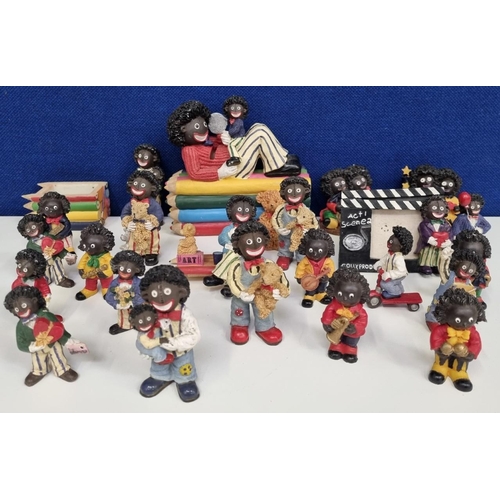 636 - An assortment of different sized, resin golly-style figural ornaments. To include a picture frame an... 