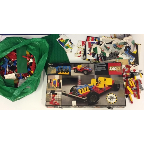 1812A - A Lego Technical Set no.853, together with a large selection of Lego pieces, leaflets & instructions... 