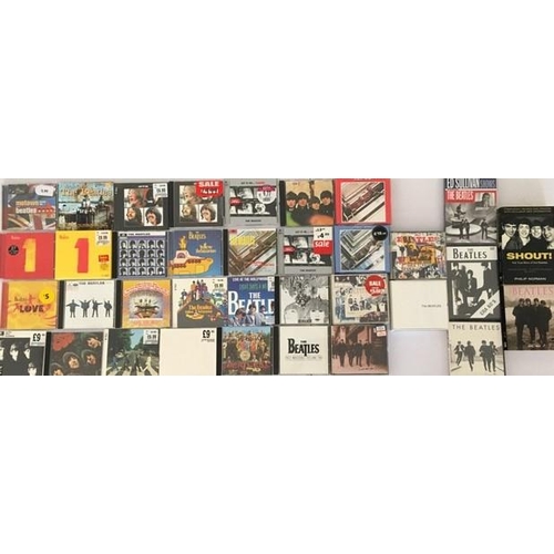 3316 - The Beatles - a collection of mostly new/unplayed CD's (x30), DVD's (x4) & Books (x2)