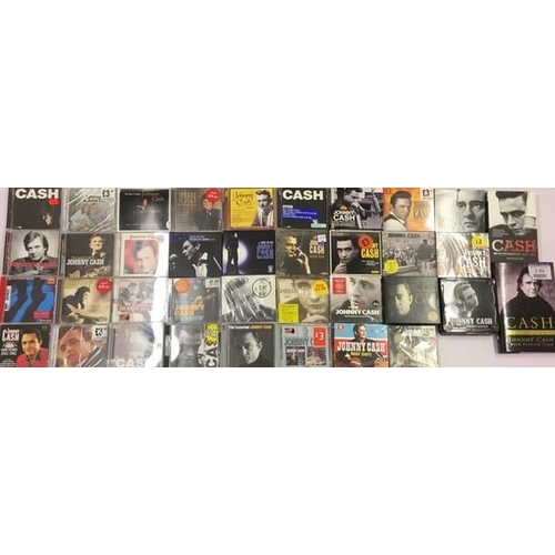 3346 - Johnny Cash - a collection of mostly new/unplayed CD's (x35), DVD's (x2) & Books (x2)