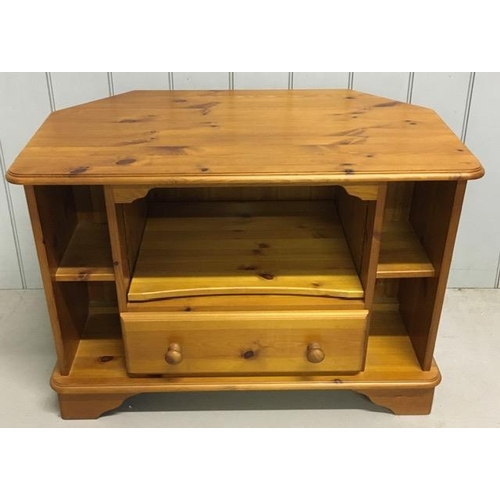 134 - A pine, corner TV cabinet. Dimensions(cm) H61, W85, D49.