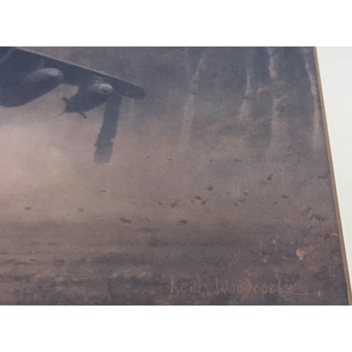 312 - A framed print, after Keith Woodcock - 'Secret Mission', featuring a harrier jet. Framed dimensions(... 