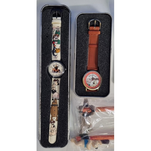 391 - An assortment of 'Wallace and Gromit' collectibles, to include two vintage 'Wesco' watches, pencils ... 