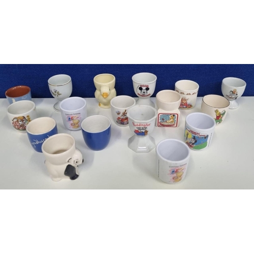 606 - A large collection of egg cups. Seventeen pieces to include a 'Sooty, Keel' TV egg cup & nursery war... 