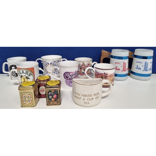 625E - A quantity of mugs & tea tins. To include two unusual glass 'Siesta Ware' 'New York' mugs, repro adv... 