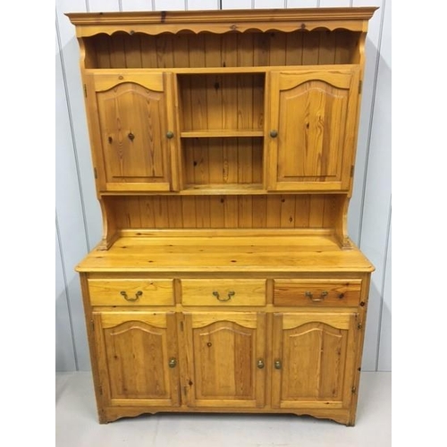 53A - A solid pine Welsh Dresser. Top half features a plate shelf, over double cupboard & display shelf. B... 