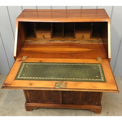 87 - A yew-veneered bureau. Fall-front, with partially fitted interior & leather writing area. Complete w... 