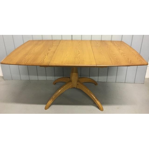 An Ercol Windsor, extending pedestal dining table. Extension leaf housed on mechanism beneath tabletop. Model 1192. Dimensions(cm) H72, W105/150, D90.