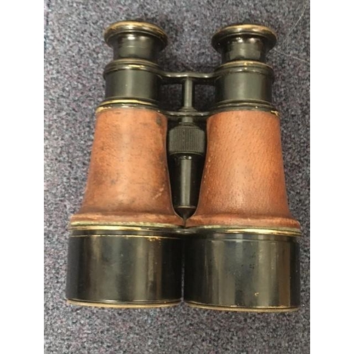 276 - A pair of early 20th century/WWI field binoculars, with  French 'Petite Fabi' lenses & original leat... 