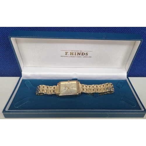 385A - An 'F. Hinds' gents, gold-tone watch in original box. Square face & link bracelet.