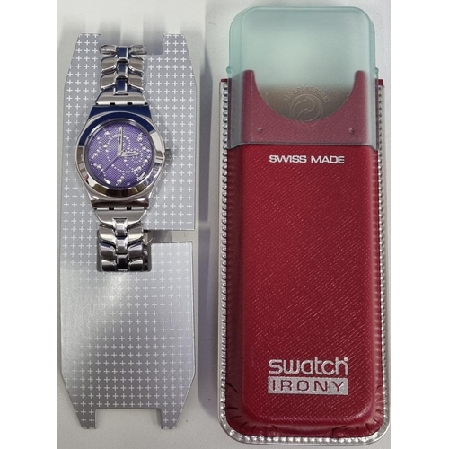 393 - An unused 'Swatch' 'Irony, Raining Star' battery operated  watch with a gem-detailed purple face, st... 