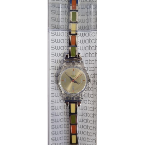 393E - An unused 'Swatch' 'Fall of Leaf' battery operated watch in autumnal colours, with a stainless-steel... 