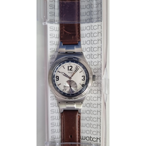 393H - An unused 'Swatch' 'Irony, Emphasized Second' watch, with world time zones & a brown leather strap, ... 