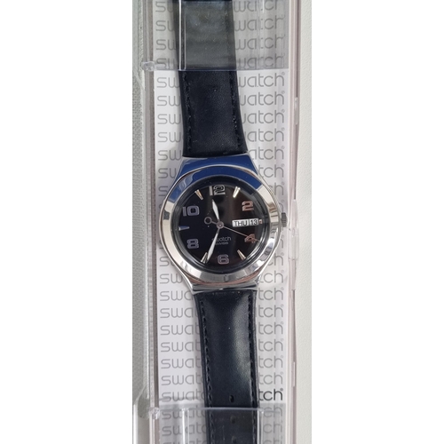 393R - An unused 'Swatch' 'Core Collection' unisex watch with a black dial & leather strap, from 2005. In a... 