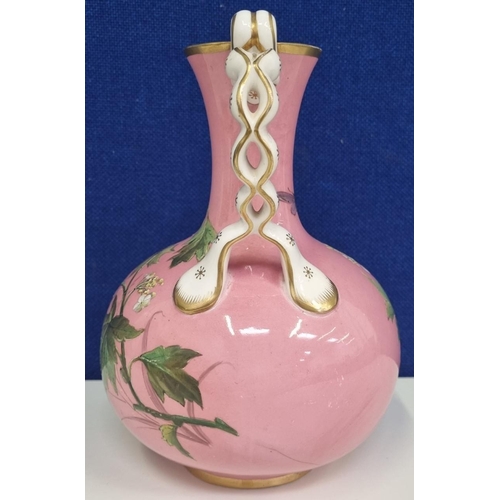 523A - A mid/late 19th 
century 'Minton' pink ground vase. A single-handled, ornately gilded example, with ... 