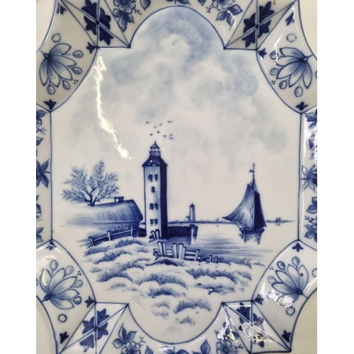 614 - A pair of decorative blue & white 'Delft' wall plates, with harbour scenes. Each with impressed '174... 