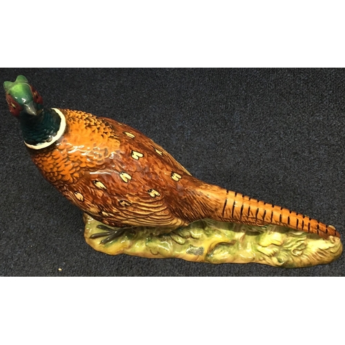 621A - A Beswick ring-necked pheasant, model no.1225. Height 19.5cm, length 25cm.