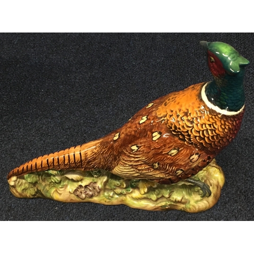 621A - A Beswick ring-necked pheasant, model no.1225. Height 19.5cm, length 25cm.