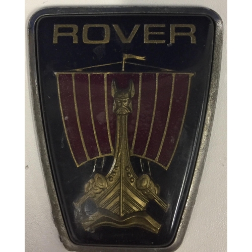 688 - A boxed, solid brass paperweight initial 'M', together with a vintage Rover car emblem.