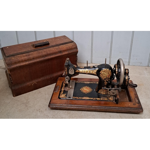 693 - A charming sewing machine & walnut case, by CS Jones Family Co. Type 7 model, date c.1901-1910.