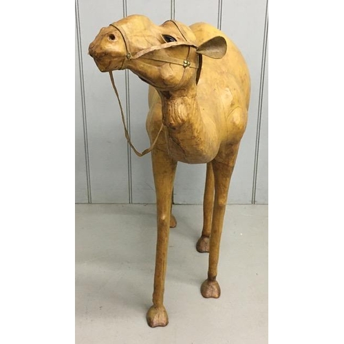 700 - A rare leather-clad, sculptured Camel figure, by Liberty of London. Likely purchased as a decorative... 