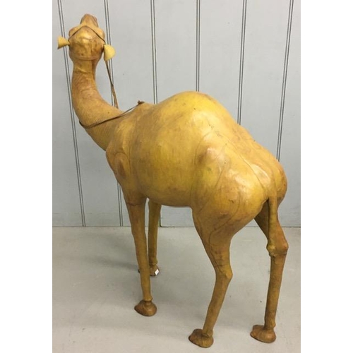 700 - A rare leather-clad, sculptured Camel figure, by Liberty of London. Likely purchased as a decorative... 