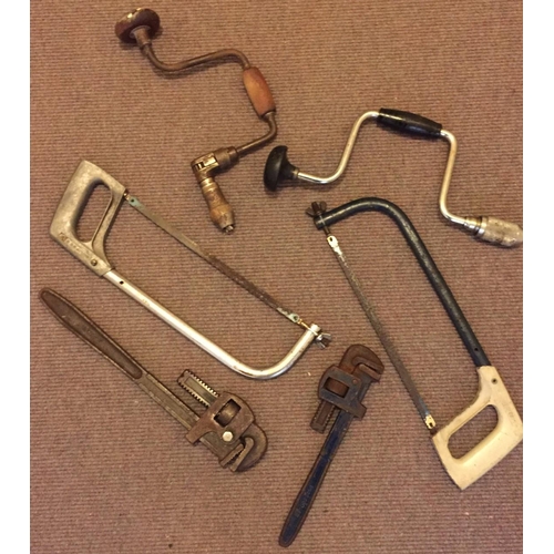 707 - A selection of six vintage hand tools. Drills, hacksaws, & pipe wrenches.