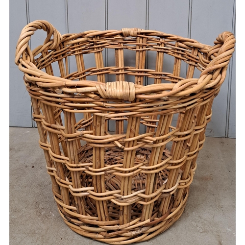 713A - A vintage, twin-handled, woven wicker log basket. Dimensions(cm) H50, W56, D56.