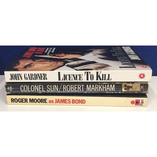 3221 - Three James Bond paperbacks, not by Ian Fleming. Includes Roger Moore as James Bond (first published... 