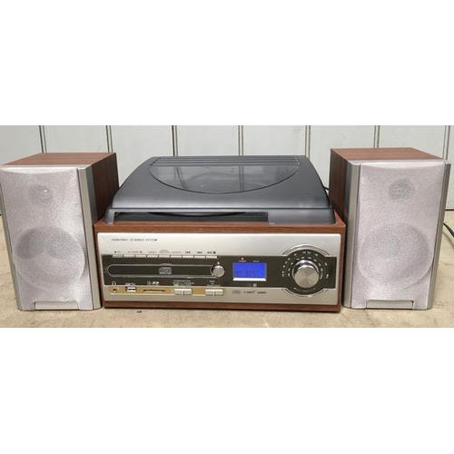 A modern all-in-one Hi-Fi system, with twin speakers. Incorporates FM/AM radio, CD player, turntable, memory card reader & USB card reader. Tested & appears in full working order.