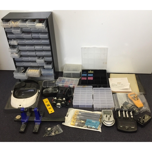 3084 - A selection of IT repairer's equipment. To include new tweezers, LED headlight, battery chargers etc... 