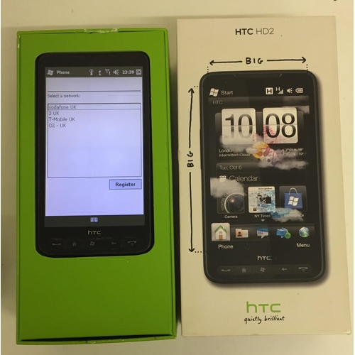 3091 - A used HTC 'HD2' mobile phone, with original box & charger. Tested & appears in full working order.