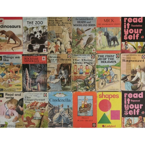 3250 - A large collection of approximately sixty-nine Ladybird books. To include early editions of 'Snow Wh... 