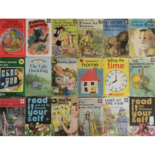 3250 - A large collection of approximately sixty-nine Ladybird books. To include early editions of 'Snow Wh... 