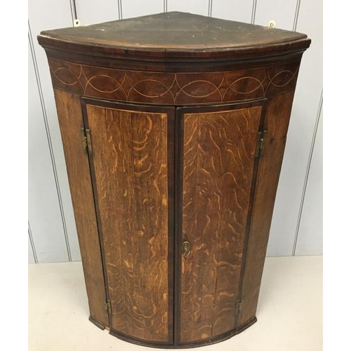 81 - A good quality, mahogany bow-fronted corner cabinet, with inlaid detailing. Key present. Dimensions(... 