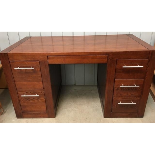 109 - A contemporary, hardwood desk, with five drawers. Dimensions(cm) H80, W144, D70.