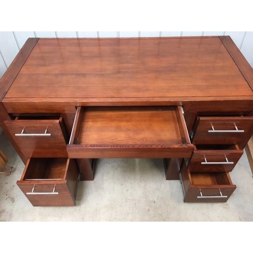 109 - A contemporary, hardwood desk, with five drawers. Dimensions(cm) H80, W144, D70.