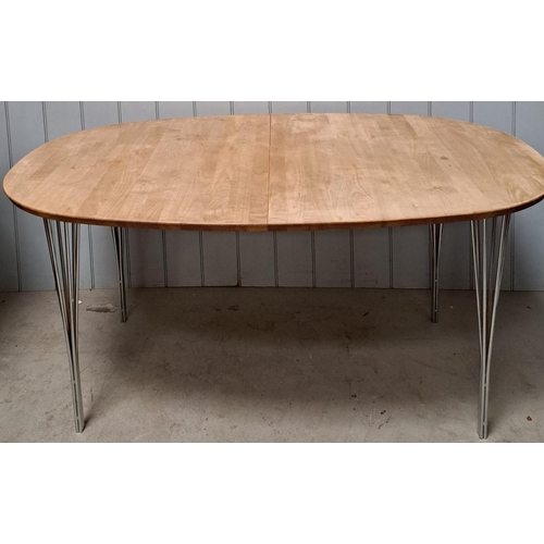 A stunning handmade, extending, Danish dining table, by 'Haslev'. Solid wood tabletop supported by four chrome legs, each of which made up of six rods. The standard table length is 160cm, extendable by additional leaves to 206cm or 256cm. The extending leaves are in an original condition. The tabletop has suffered all over sun fading. Other dimensions(cm) H74, D105.