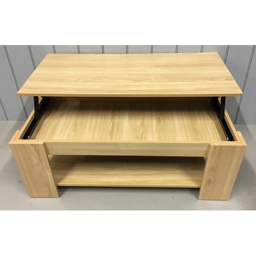 118 - A contemporary, beech coloured lift-top coffee table. Table features a mechanical lifting lid for ex... 