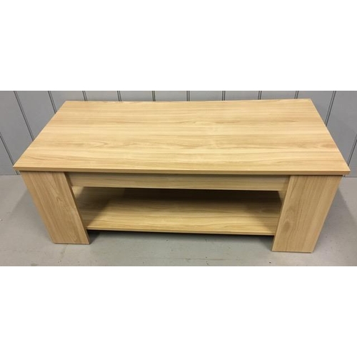 118 - A contemporary, beech coloured lift-top coffee table. Table features a mechanical lifting lid for ex... 