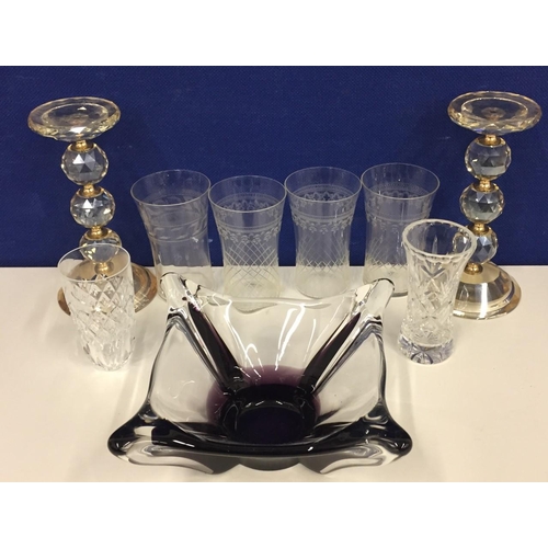 201 - A selection of glassware, including two crystal pillar candle holders, Murano style purple centrepie... 