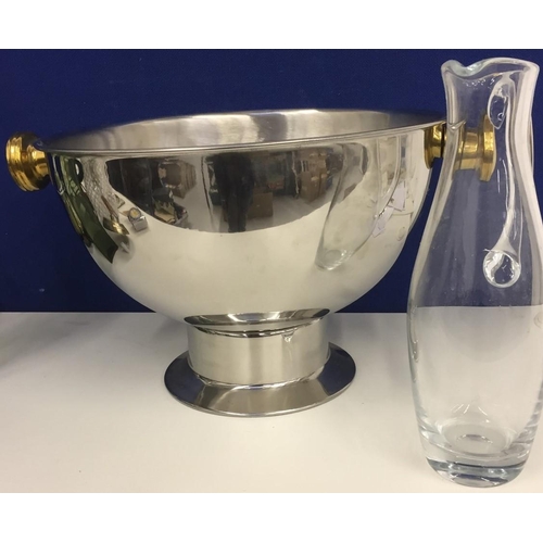 440 - A large stainless steel punch bowl (width 46cm), together with a glass pitcher.