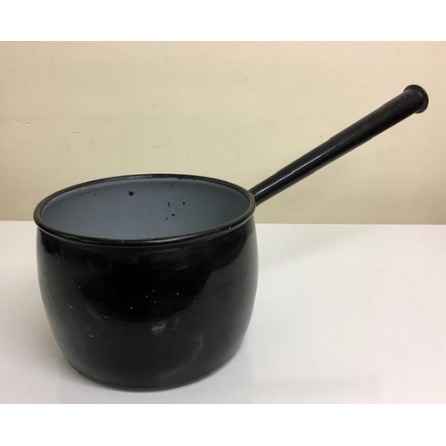 448 - A vintage, cast iron, long-handled saucepan.